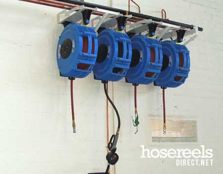 Recoila hose reels hanging in a workshop ready for compressed air & water