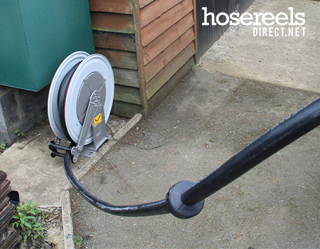 Diesel dispensing reel being used on a farm