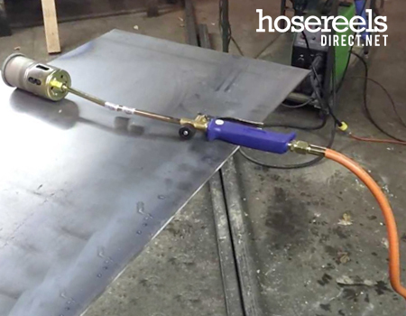 Propane heat gun used with propane hose reels