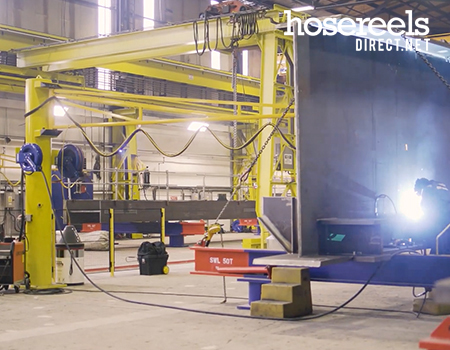 Engineer using welding reels installed in a fabrication bay at Severfield